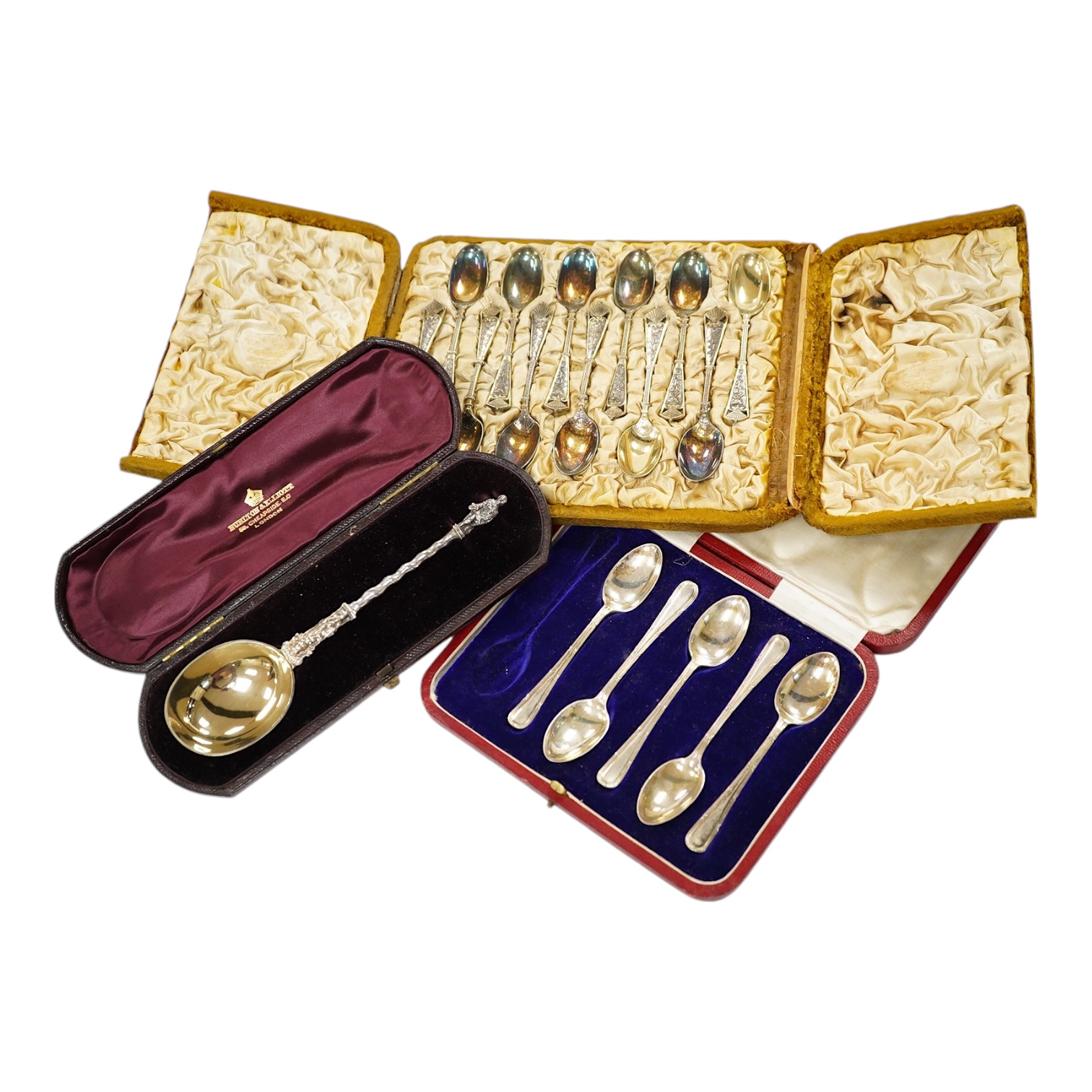 A cased set of twelve late Victorian silver gilt coffee spoons, by Elkington & Co, Birmingham 1890, one other later incomplete set of silver teaspoons and a Victorian cased silver apostle spoon. Condition - fair